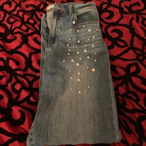 Blue jeans with white and silver pearls accents